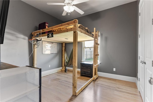 unfurnished bedroom featuring light wood-style flooring and baseboards