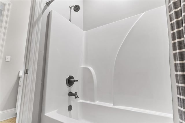 full bath featuring shower / bath combo with shower curtain