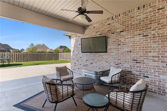 view of patio / terrace featuring a trampoline, ceiling fan, and a fenced backyard
