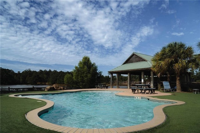 pool with a patio, a gazebo, and a lawn