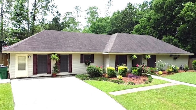 232 Chateau Dr, Slidell, LA 70460 - ranch-style house with a front lawn, a shingled roof, and concrete driveway
