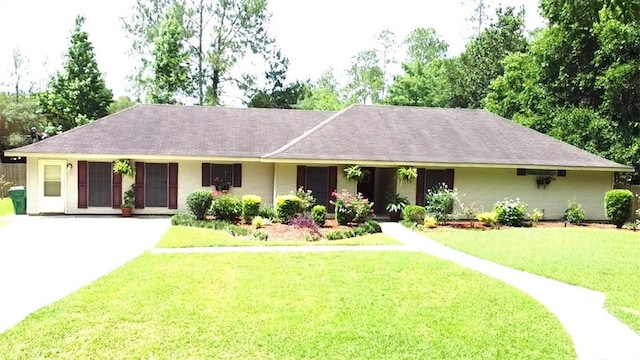 232 Chateau Dr, Slidell, LA 70460 - single story home featuring driveway, a front lawn, and roof with shingles