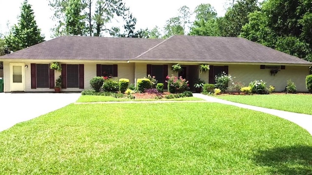 232 Chateau Dr, Slidell, LA 70460 - single story home with a front lawn, a shingled roof, brick siding, and driveway