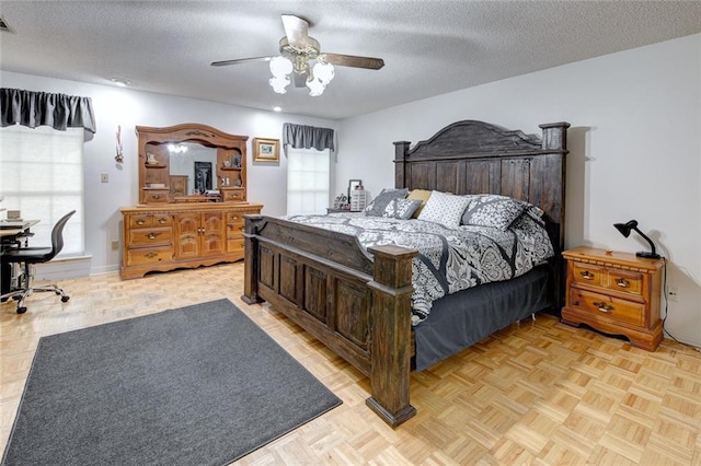 232 Chateau Dr, Slidell, LA 70460 - bedroom with a ceiling fan, a desk, and a textured ceiling