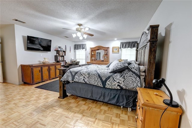 232 Chateau Dr, Slidell, LA 70460 - bedroom featuring a textured ceiling and a ceiling fan