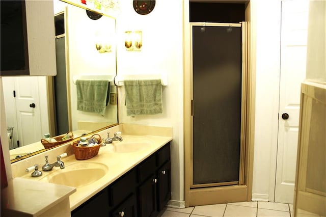 232 Chateau Dr, Slidell, LA 70460 - bathroom with a shower stall, double vanity, and tile patterned flooring