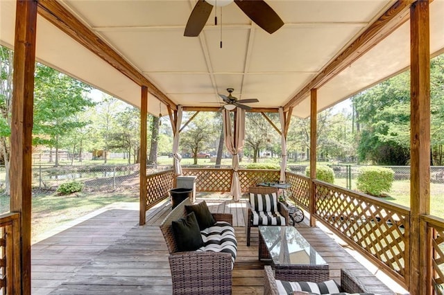 232 Chateau Dr, Slidell, LA 70460 - wooden deck with a ceiling fan and an outdoor hangout area