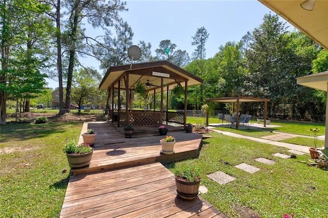232 Chateau Dr, Slidell, LA 70460 - deck featuring a gazebo, a ceiling fan, and a yard