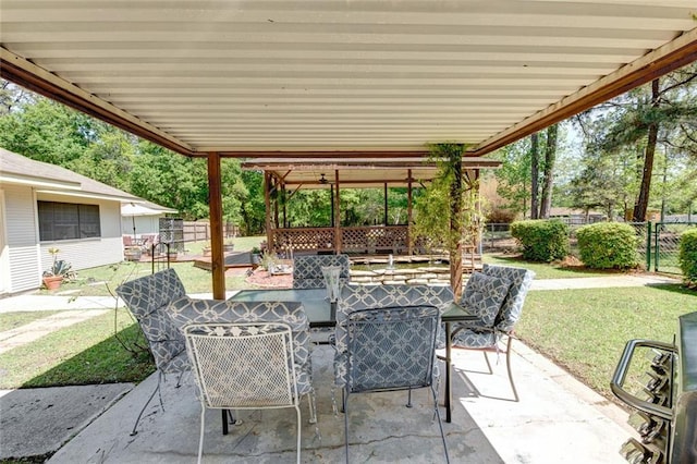 232 Chateau Dr, Slidell, LA 70460 - fenced backyard with outdoor dining space and a patio