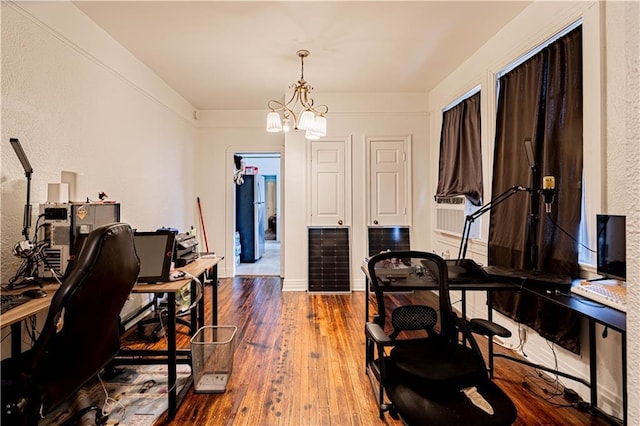 8632 Apple St, New Orleans, LA 70118 - office area featuring a textured wall, a notable chandelier, and hardwood / wood-style floors