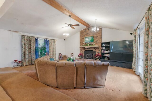 1805 13th Ave, Franklinton, LA 70438 - carpeted living room featuring a chandelier, ceiling fan, and a brick fireplace