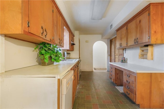 1805 13th Ave, Franklinton, LA 70438 - kitchen with dishwasher, light countertops, brown cabinetry, and brick patterned floors