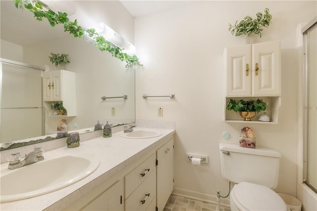 1805 13th Ave, Franklinton, LA 70438 - full bath with toilet, a shower with shower door, baseboards, and double vanity