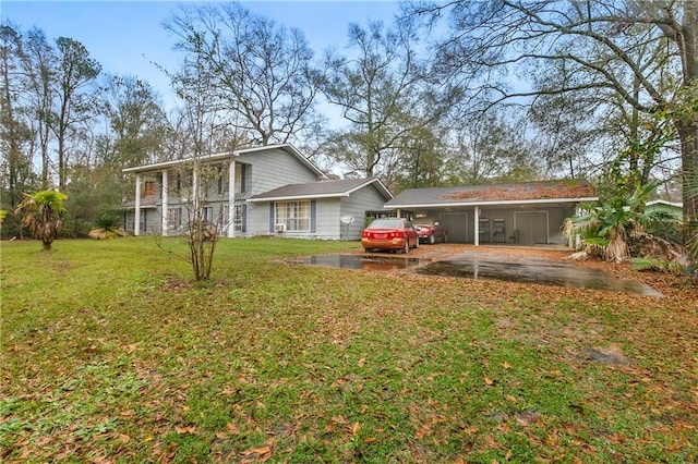 1805 13th Ave, Franklinton, LA 70438 - back of property featuring a carport, a lawn, and driveway