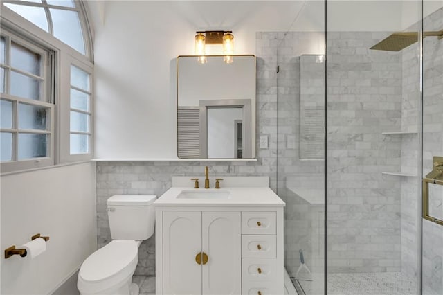 818 Bourbon St Unit 1C, New Orleans, LA 70116 - full bathroom with toilet, tiled shower, vanity, and tile walls