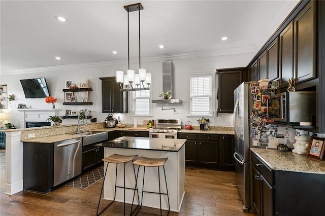 6038 Orleans Ave, New Orleans, LA 70124 - kitchen with wall chimney range hood, ornamental molding, appliances with stainless steel finishes, light stone counters, and a sink