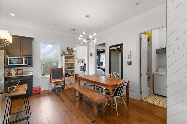 6038 Orleans Ave, New Orleans, LA 70124 - dining area with a chandelier, washer / clothes dryer, hardwood / wood-style floors, and ornamental molding