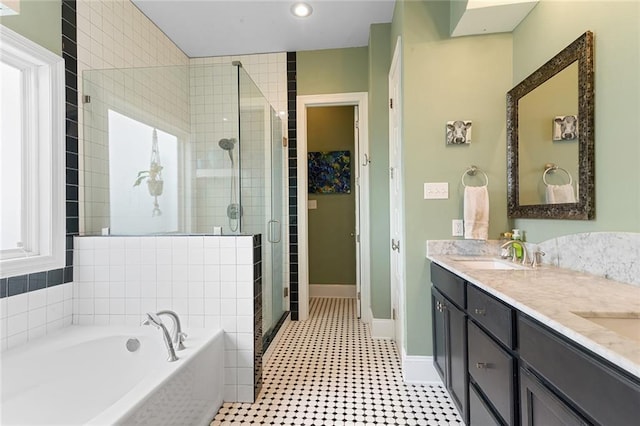 6038 Orleans Ave, New Orleans, LA 70124 - full bath with a bath, baseboards, a sink, double vanity, and a stall shower