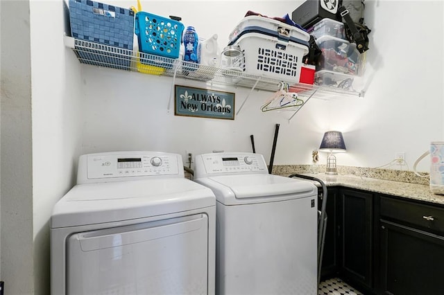 6038 Orleans Ave, New Orleans, LA 70124 - laundry room featuring cabinet space and washer and clothes dryer