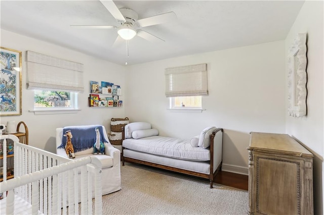 bedroom with baseboards and ceiling fan