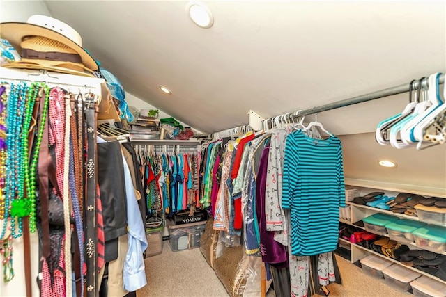 spacious closet featuring carpet and lofted ceiling