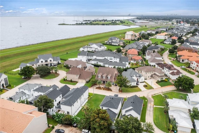 birds eye view of property featuring a water view and a residential view