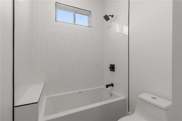 bathroom with toilet and tub / shower combination