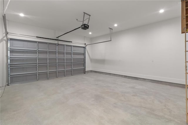 garage with baseboards, a garage door opener, and recessed lighting