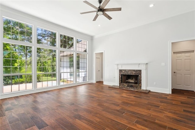 42 Green Hills Dr, Covington, LA 70435 - unfurnished living room with crown molding, ceiling fan, wood finished floors, a premium fireplace, and baseboards