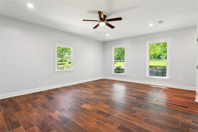 42 Green Hills Dr, Covington, LA 70435 - unfurnished room with visible vents, a ceiling fan, dark wood-style floors, and a healthy amount of sunlight