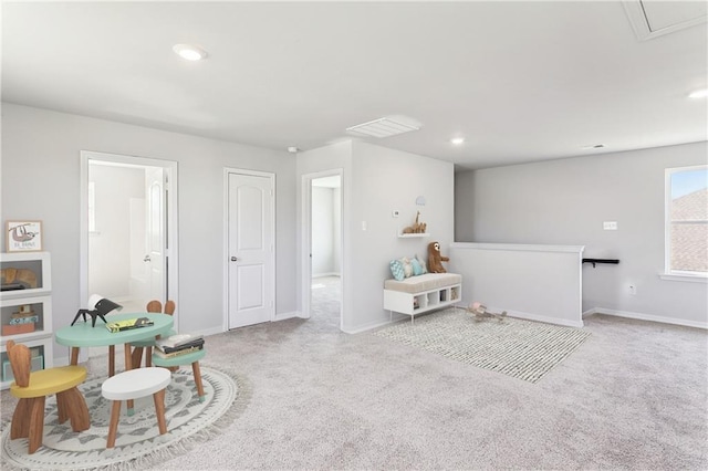 living area with recessed lighting, carpet, baseboards, and attic access