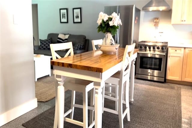 dining space with carpet floors