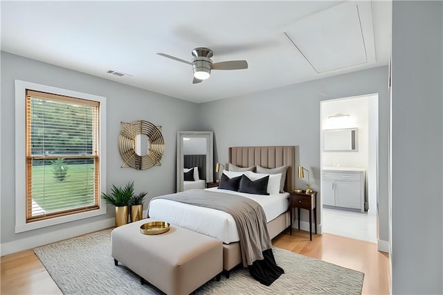 72315 Kustenmacher Rd, Abita Springs, LA 70420 - bedroom featuring attic access, light wood finished floors, ensuite bath, and a ceiling fan