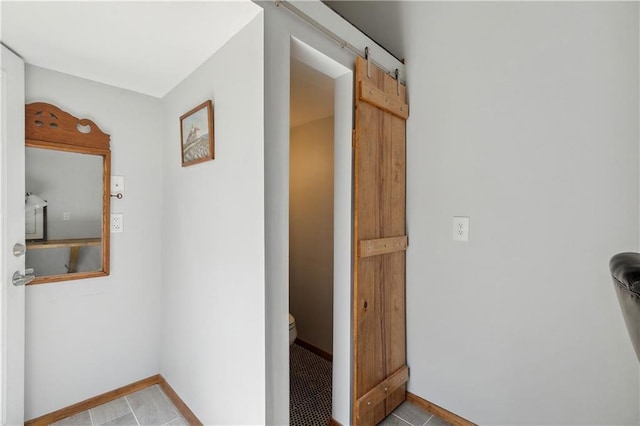 72315 Kustenmacher Rd, Abita Springs, LA 70420 - corridor with baseboards and a barn door