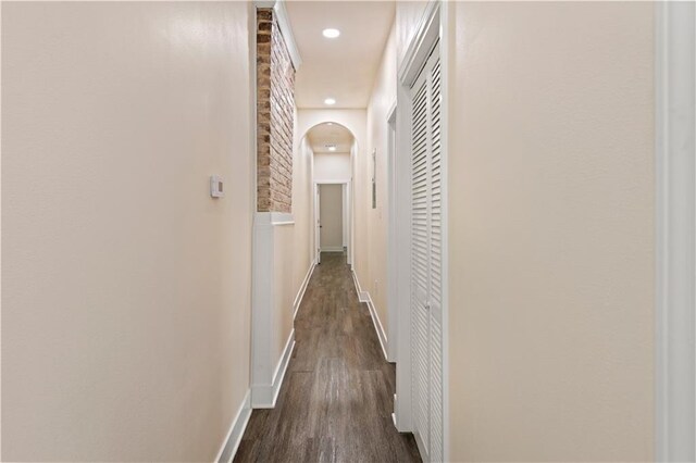 391214 Thalia St, New Orleans, LA 70125 - corridor featuring recessed lighting, arched walkways, dark wood-style flooring, and baseboards