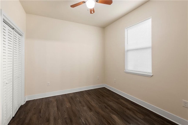 391214 Thalia St, New Orleans, LA 70125 - unfurnished bedroom featuring a closet, dark wood-style flooring, baseboards, and a ceiling fan