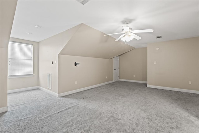 1213 Rue Degas, Mandeville, LA 70471 - additional living space featuring carpet floors, a ceiling fan, baseboards, and vaulted ceiling