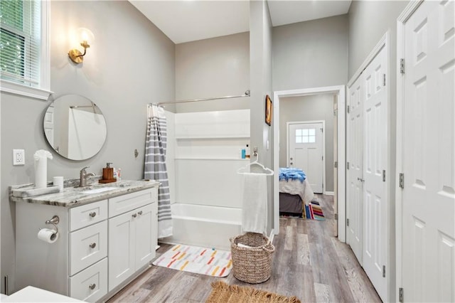 202729 Cambronne St, New Orleans, LA 70118 - bathroom featuring wood finished floors, vanity, and shower / bathtub combination with curtain