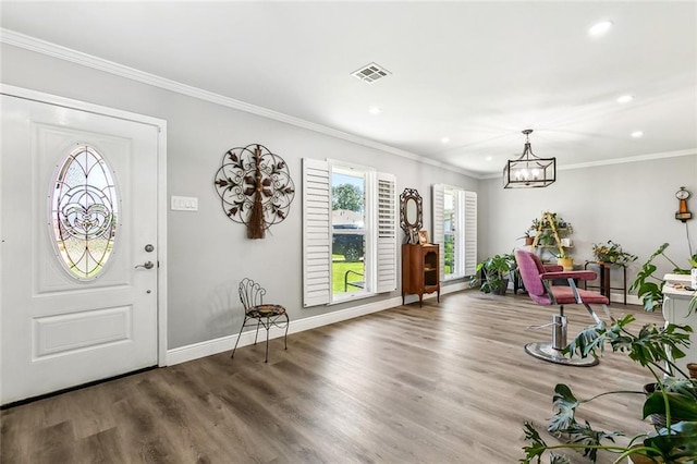 foyer with wood finished floors, a notable chandelier, visible vents, and recessed lighting