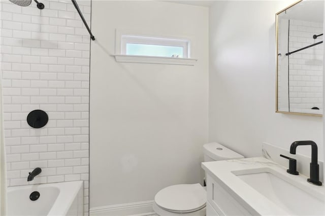 bathroom with toilet, vanity, shower / bath combination, and baseboards
