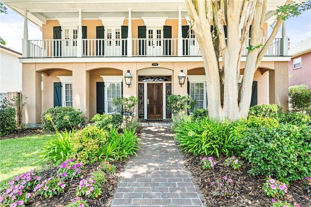 4516 Beau Lac Ln, Metairie, LA 70002 - doorway to property with a balcony and stucco siding