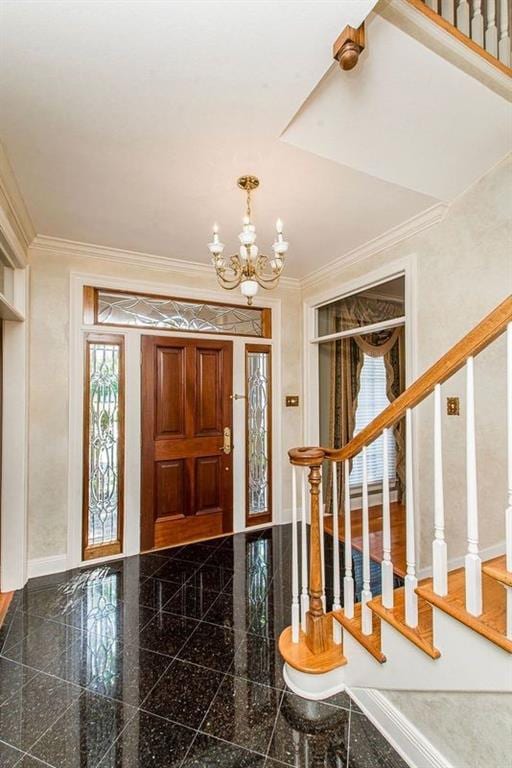 4516 Beau Lac Ln, Metairie, LA 70002 - entryway featuring crown molding, an inviting chandelier, baseboards, and granite finish floor