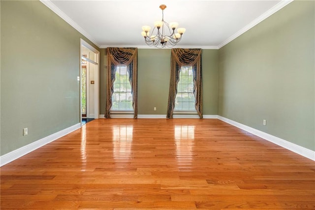 4516 Beau Lac Ln, Metairie, LA 70002 - empty room featuring a chandelier, crown molding, and light wood-type flooring
