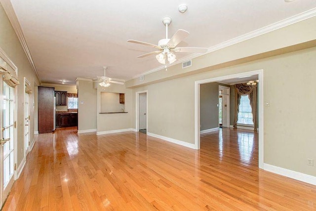 4516 Beau Lac Ln, Metairie, LA 70002 - unfurnished living room with ornamental molding, visible vents, light wood finished floors, and a healthy amount of sunlight
