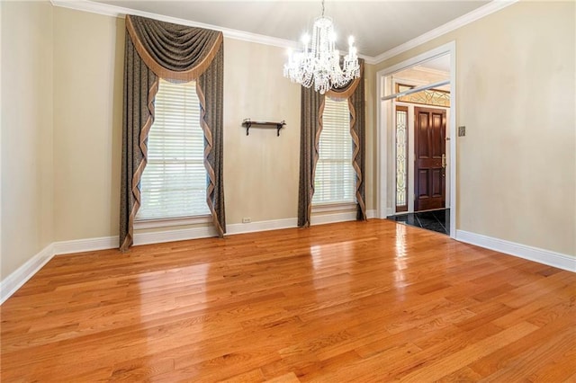 4516 Beau Lac Ln, Metairie, LA 70002 - spare room featuring a chandelier, ornamental molding, and wood finished floors