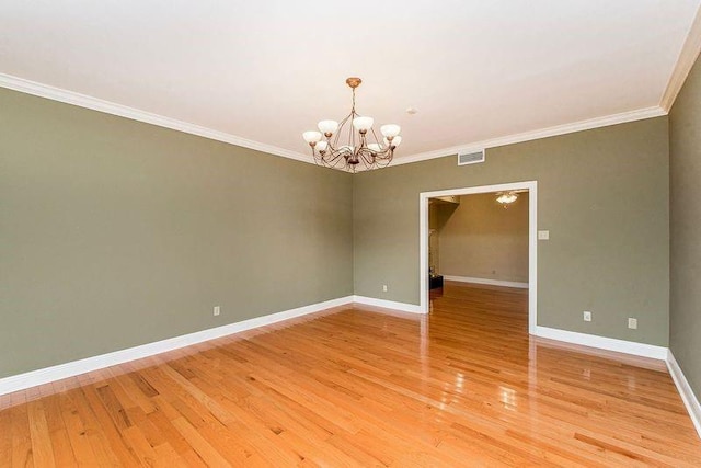 4516 Beau Lac Ln, Metairie, LA 70002 - spare room with visible vents, baseboards, an inviting chandelier, and crown molding