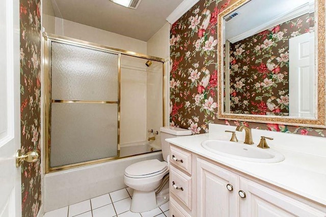 4516 Beau Lac Ln, Metairie, LA 70002 - bathroom with toilet, wallpapered walls, vanity, shower / bath combination with glass door, and tile patterned flooring