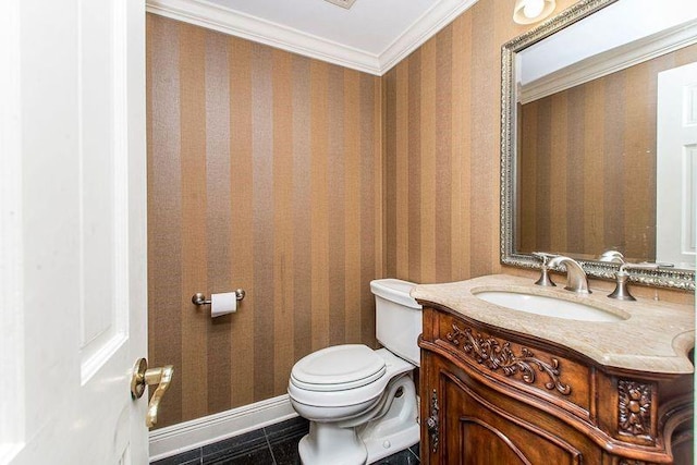 4516 Beau Lac Ln, Metairie, LA 70002 - half bathroom featuring baseboards, toilet, crown molding, vanity, and tile patterned floors