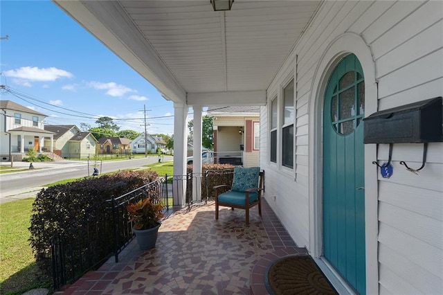 2524 Hamilton St, New Orleans, LA 70118 - view of patio / terrace with covered porch and a residential view