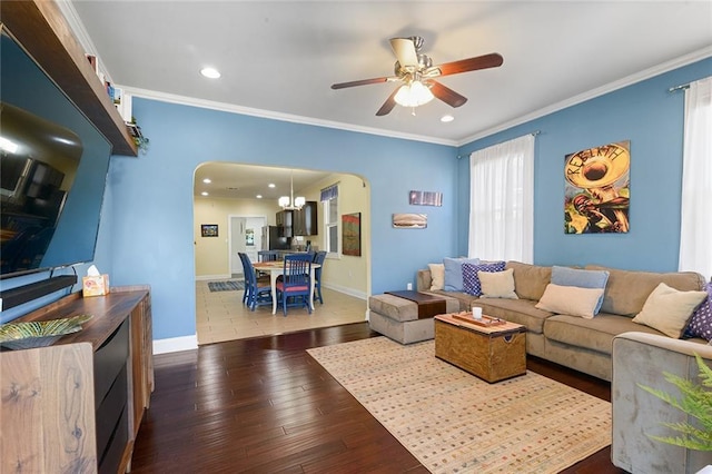 2524 Hamilton St, New Orleans, LA 70118 - living room featuring arched walkways, hardwood / wood-style floors, a ceiling fan, and crown molding